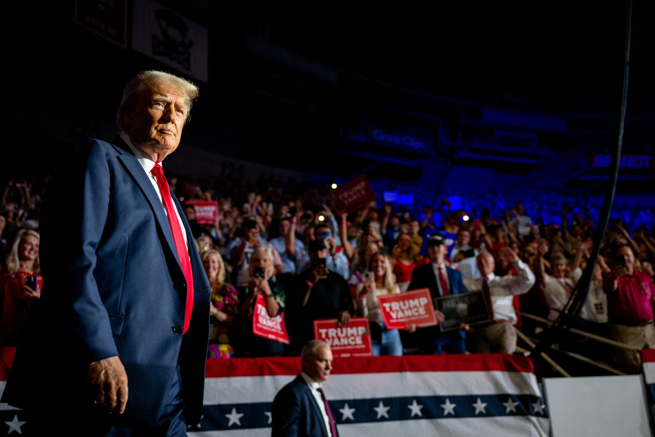 Republican Presidential nominee former President Donald Trump arrives at his campaign rally at the Bojangles Coliseum on Wednesday in Charlotte, North Carolina. The rally is the former president's first since President Joe Biden announced he would be ending his reelection bid.