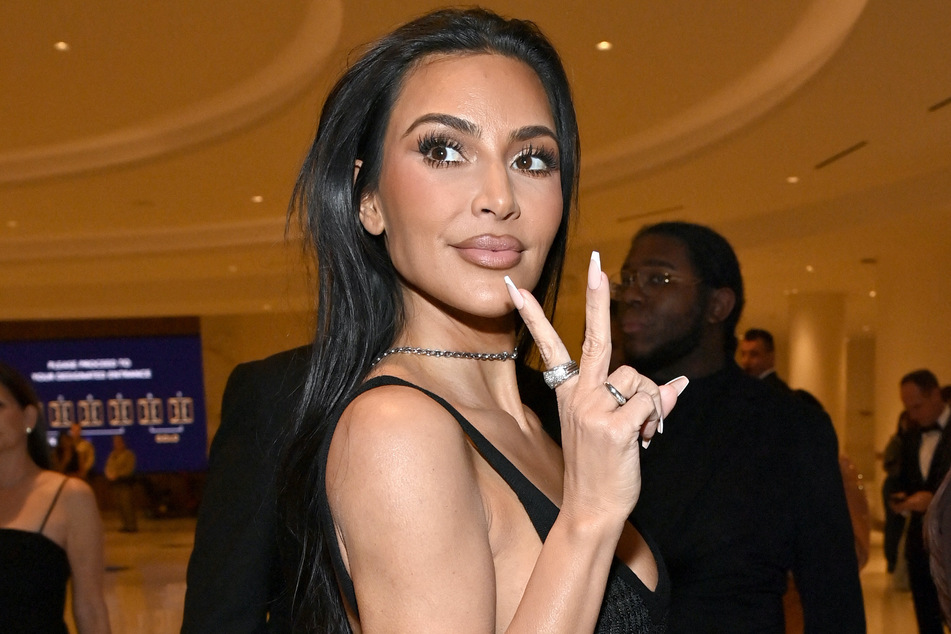Kim Kardashian channeled her inner Saint West by flipping the bird at the paparazzi.