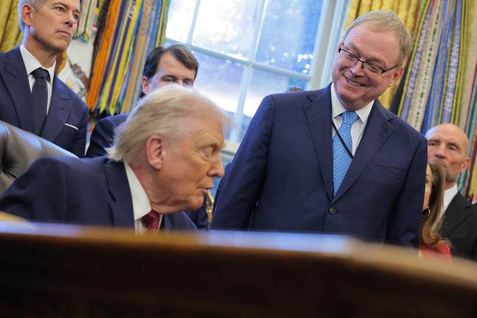 President Donald Trump (front l.) signaled Friday that he would be reluctant to lose his economic adviser, Kevin Hassett (front r.), a top contender to be the next Federal Reserve chairman.