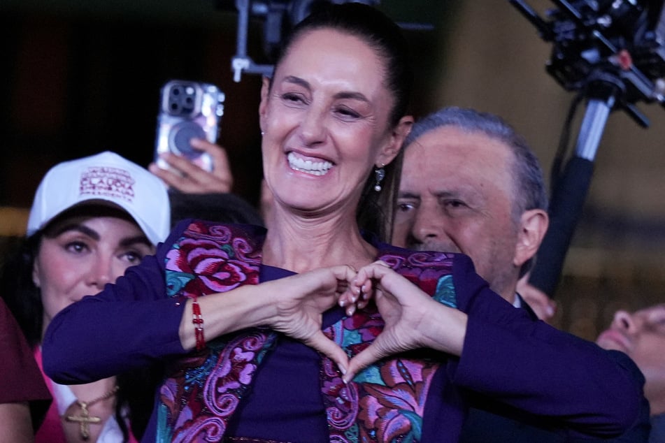 Claudia Sheinbaum makes a heart gesture to the crowd after winning election to become Mexico's next president.