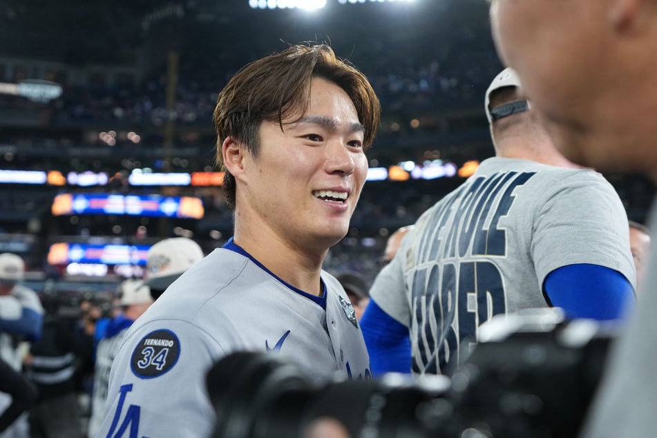 Los Angeles Dodgers pitcher Yoshinobu Yamamoto reacts after defeating the Toronto Blue Jays in the eleventh inning of game seven of the 2025 MLB World Series at Rogers Centre.