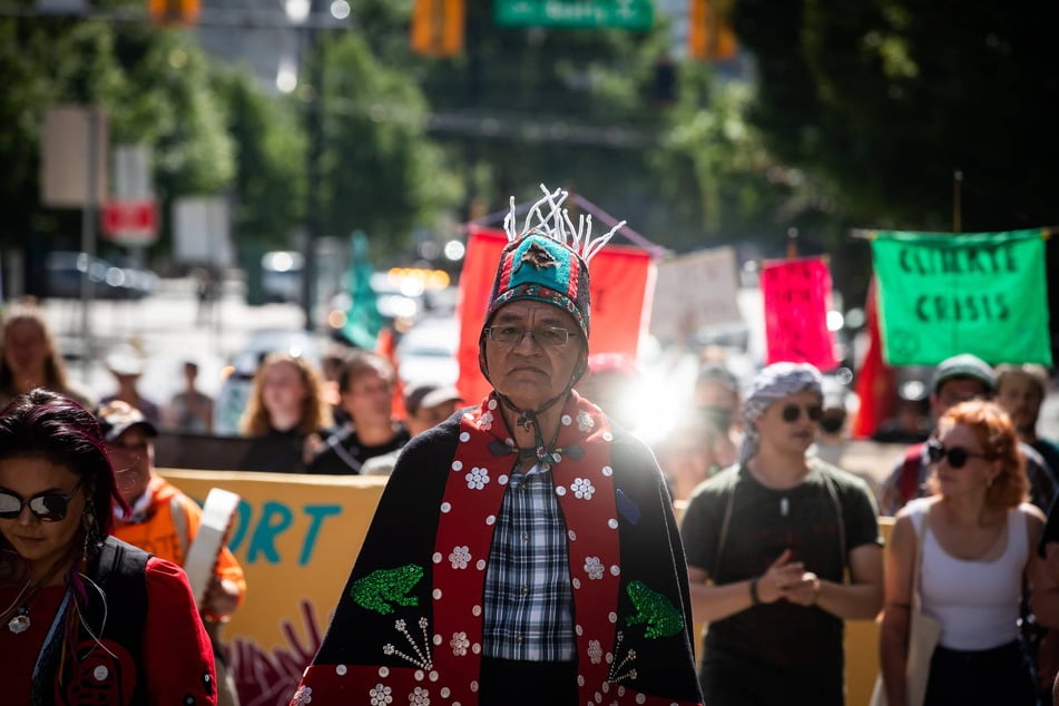 Chief Na'Moks leads a protest march against fracking in Vancouver, Canada.
