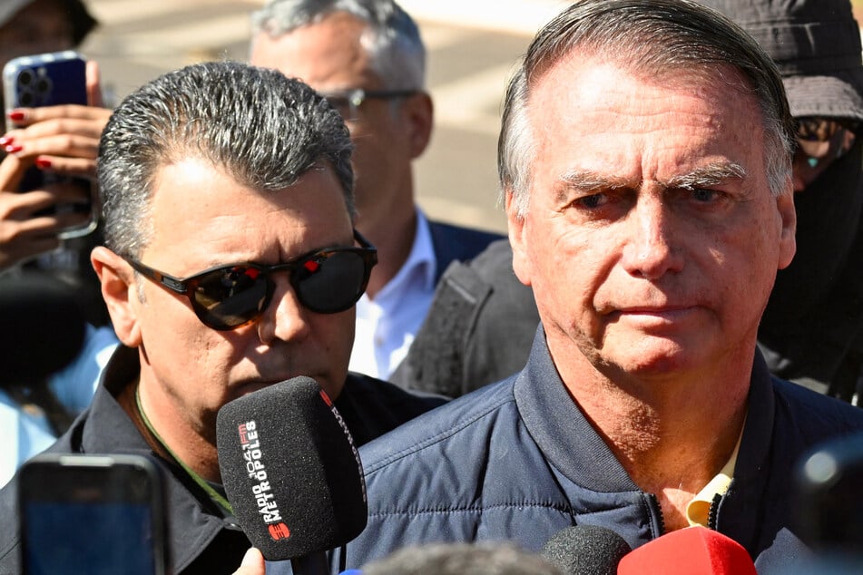 Brazil police raid home of Bolsonaro after Trump calls coup trial a "witch hunt"