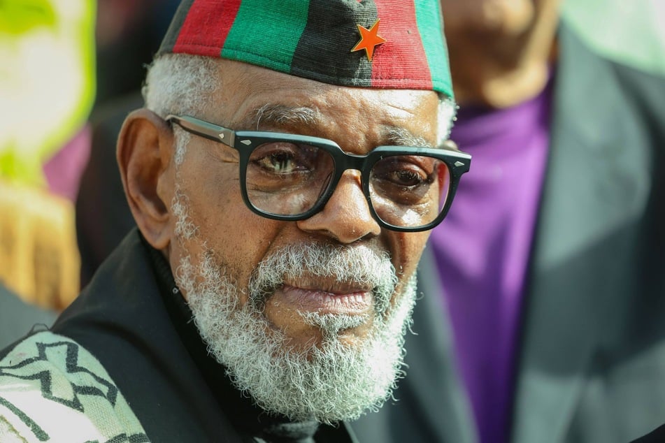 Omali Yeshitela, co-founder and leader of the African People's Socialist Party and the Uhuru Movement, meets with supporters outside the Sam Gibbons US District Courthouse after his sentencing hearing on December 16, 2024.
