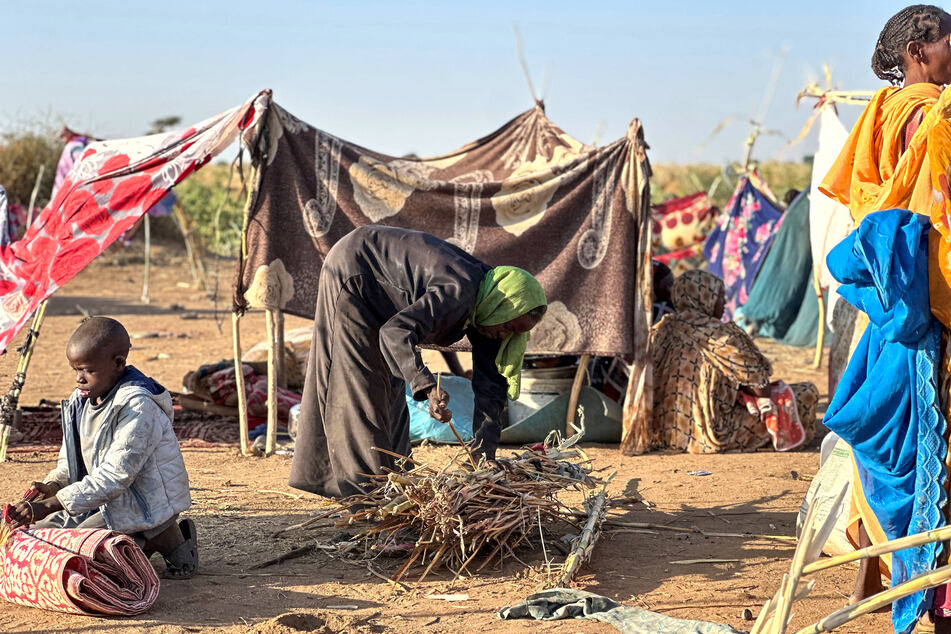 Displaced Sudanese who fled El-Fasher after the city fell to the Rapid Support Forces set up camp in the town of Tawila in the western Darfur region on October 28, 2025.