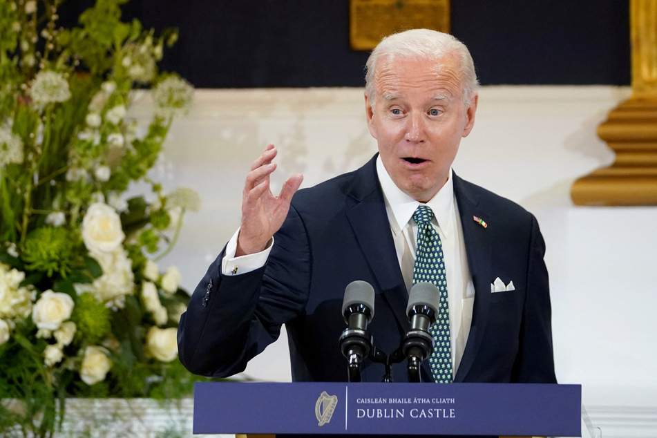 President Joe Biden speaks as he attends a dinner at Dublin Castle in Ireland.