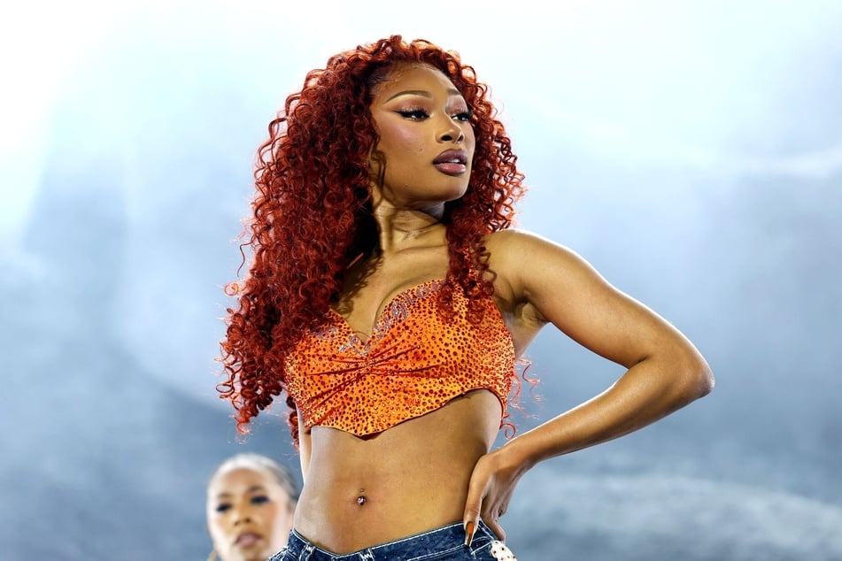 Megan Thee Stallion's former cameraman says his hours and pay were slashed after he spoke out about a shocking on-tour incident.