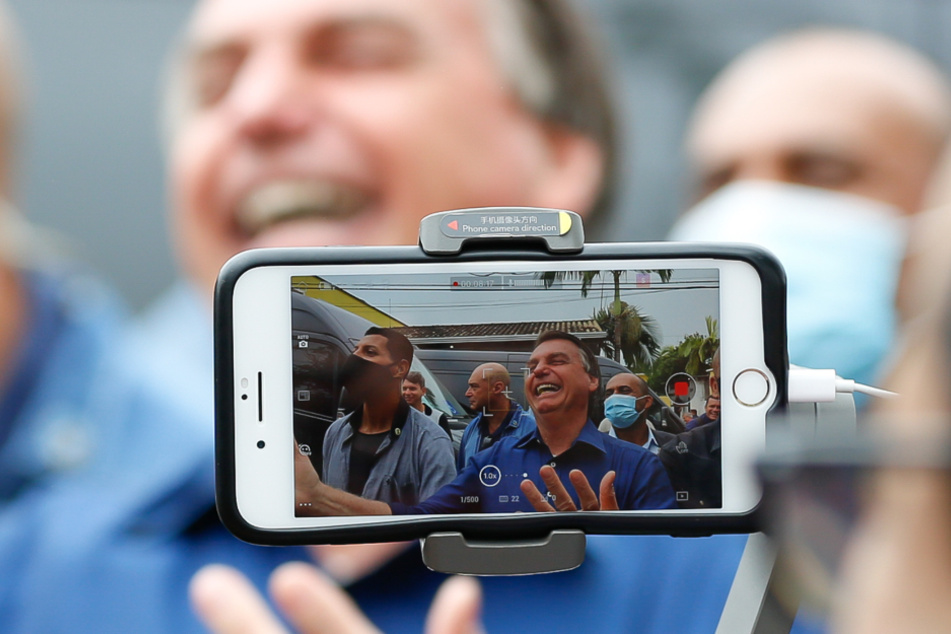 The image provided by the Brazilian president's office shows Jair Bolsonaro at a meeting with supporters in El Dorado.