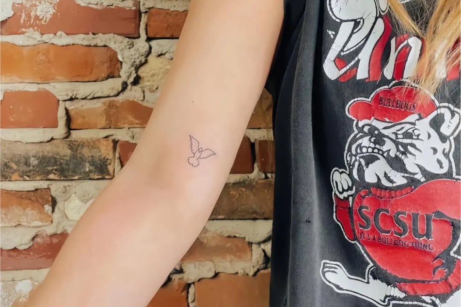 Presley's tattoo turned out looking like a penis with wings rather than a dove.