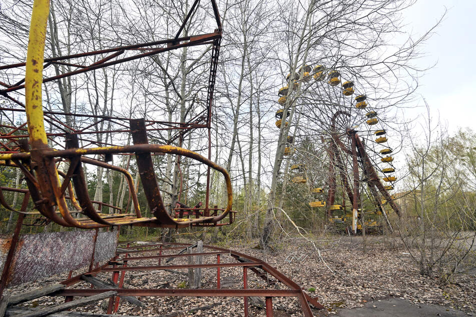 A photograph shows a ferris wheel in the ghost city of Pripyat near the Chernobyl nuclear power plant on April 23, 2026.