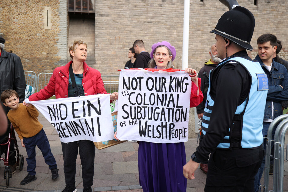 People protest ahead of the proclamation ceremony for the UK's King Charles at Cardiff Castle in Wales.