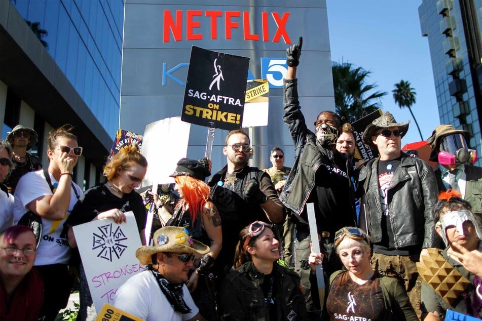 SAG-AFTRA members during a Post Apocalyptic themed picket outside Netflix studios on Wednesday, as a tentative labor agreement has been reached between the actors union and the Association of Motion Picture and Television Producers.