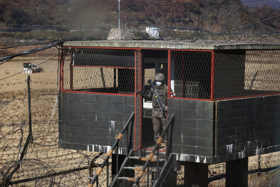 A South Korean soldier at a guard post near the demilitarized zone separating North and South Korea, who have ramped up tensions with jets and artillery fire.