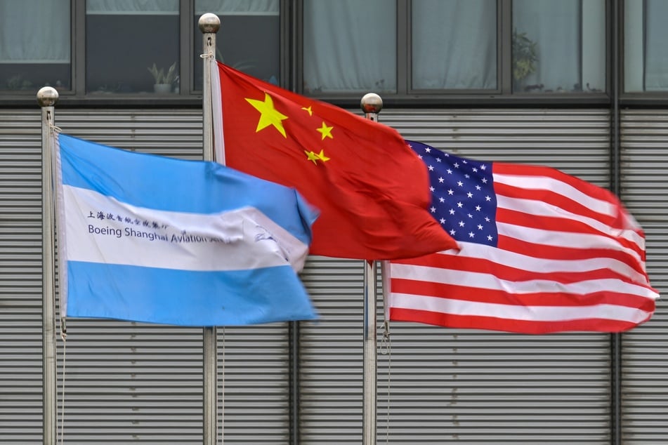 The Chinese and American flags flutter in the wind at the Boeing Shanghai Aviation Services facilities near the Shanghai Pudong International Airport in China.