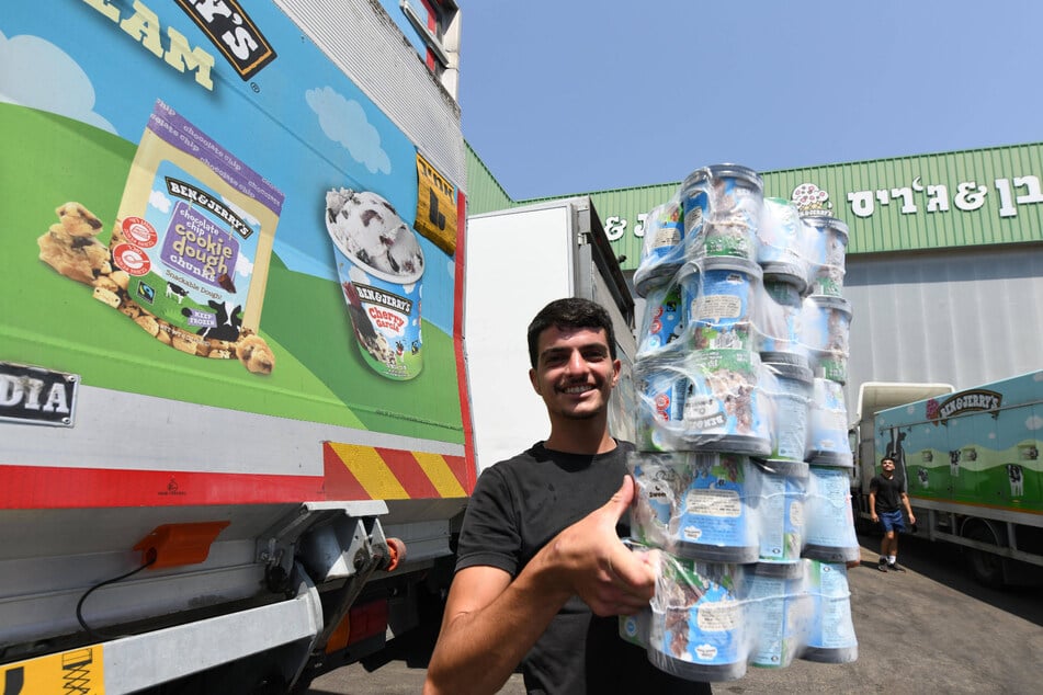 A worker handles tubs of Ben &amp; Jerry's ice cream at a factory in Beer Tuvia in southern Israel.