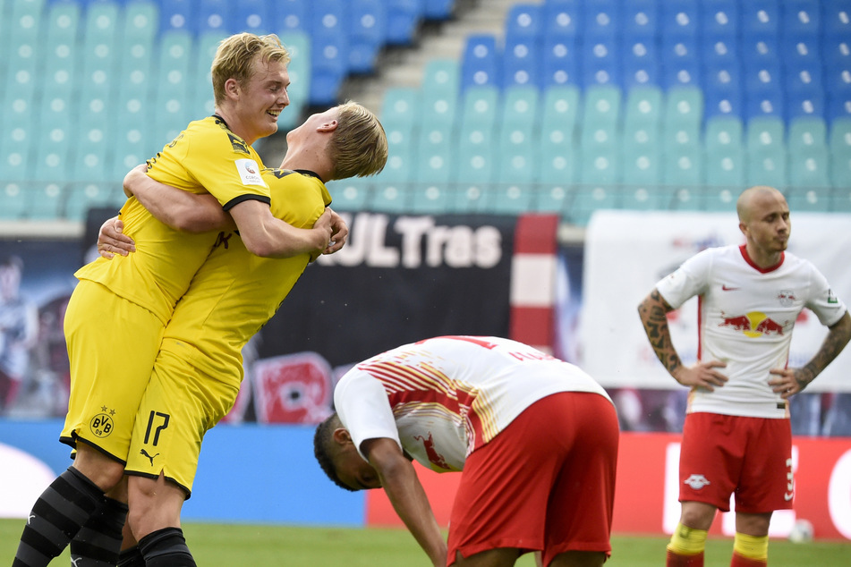 Freud und Leid auf einem Bild: Während sich Dortmunds Julian Brandt (l.) und Erling Haaland über das 2:0 freuen, sind Tyler Adams und Angelino (r.) enttäuscht.