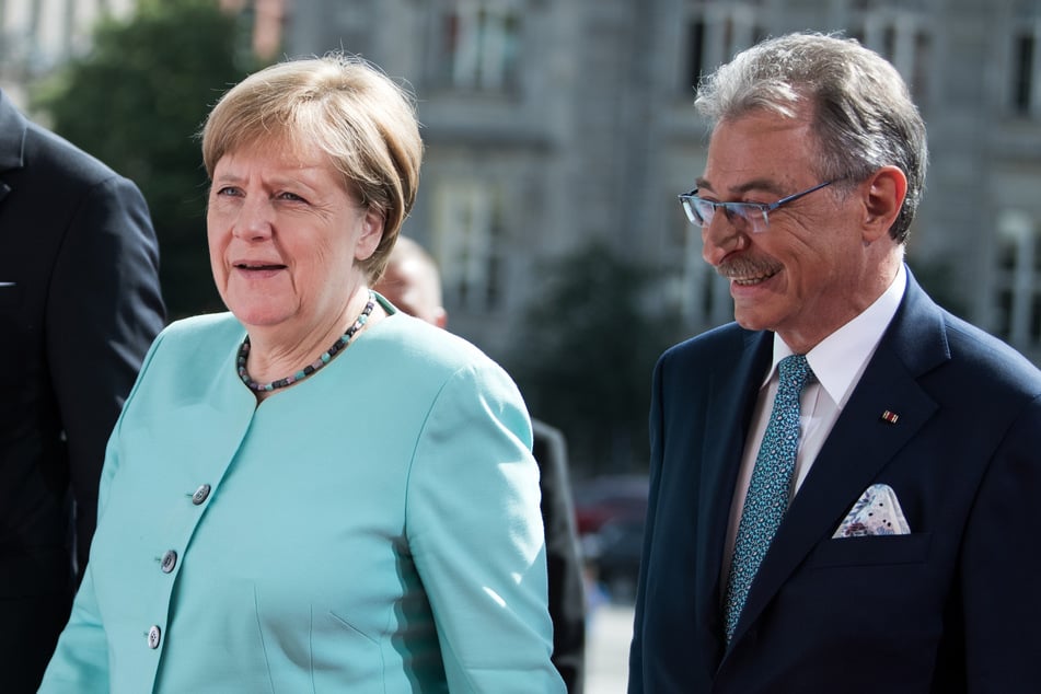 Bundeskanzlerin Angela Merkel (CDU) wird von Dieter Kempf, Präsident des Bundesverbands der Deutschen Industrie (BDI).