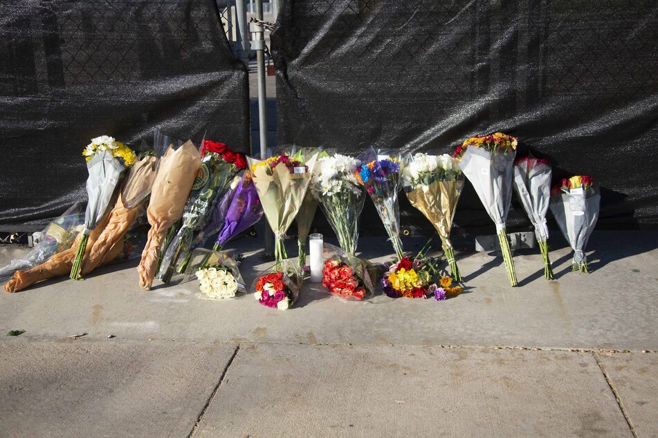 Flowers left outside the venue at NRG Park in Houston, where eight people died after a deadly crowd surge during Travis Scott's performance at AstroWorld.