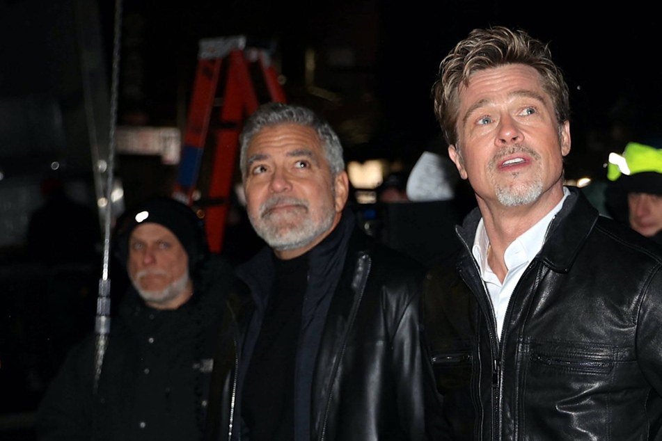 Brad Pitt (r) and George Clooney have reunited for Apple TV+'s Wolves.