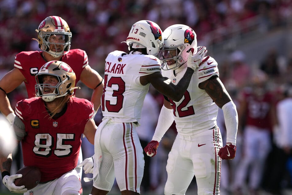 Arizona Cardinals safety Dadrion Taylor-Demerson (r.) celebrates with cornerback Kei'Trel Clark after defending a pass intended for San Francisco 49ers tight end George Kittle during the third quarter at Levi's Stadium.