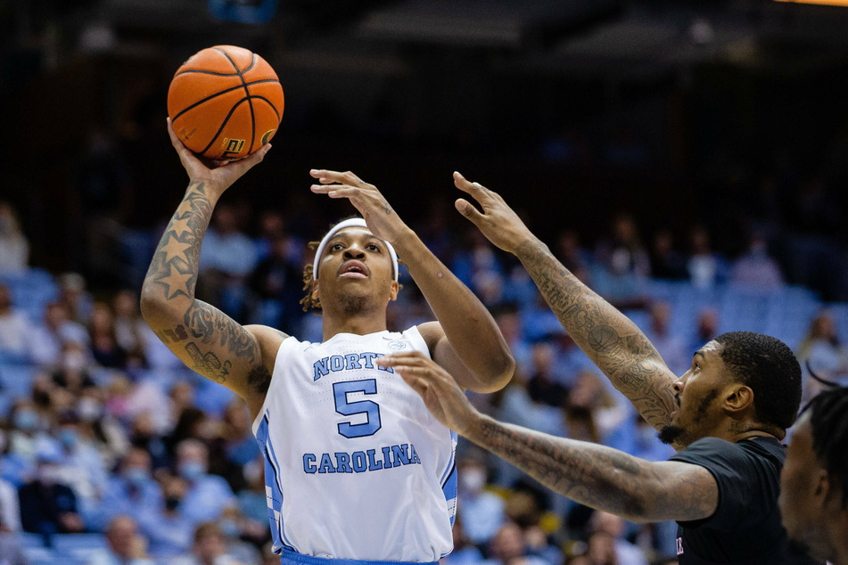 Tar Heels forward Armando Bacot (l) led his team with 23 points against Duke.