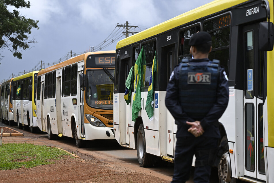 Many demonstrators were detained and placed on buses.