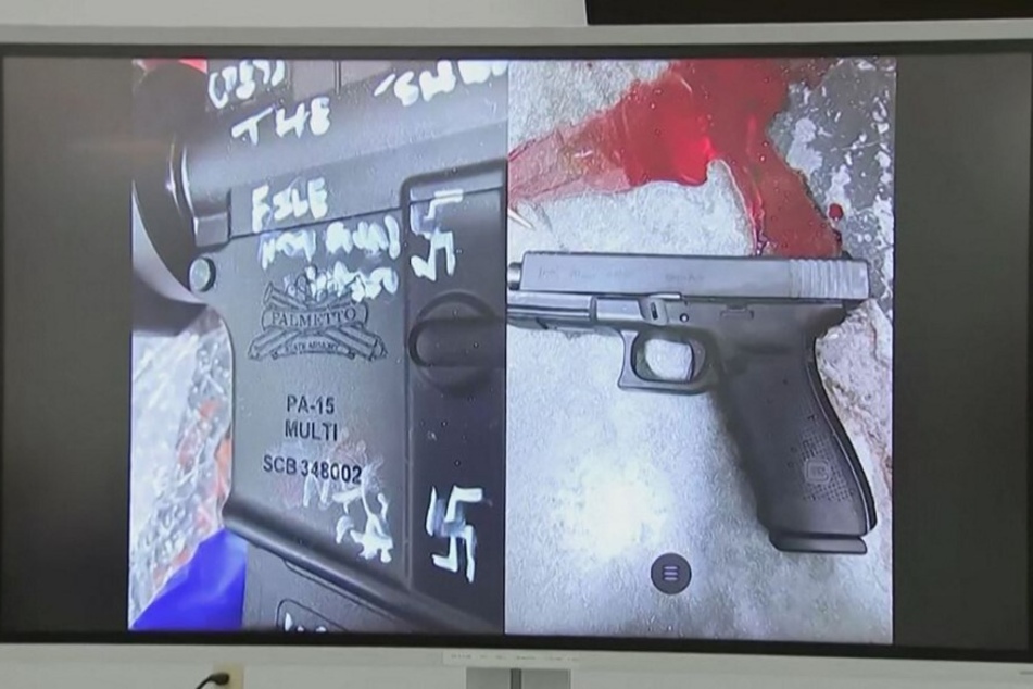 A press conference screen displays a handgun found on the scene of a shooting in Jacksonville, Florida, on August 26, 2023.