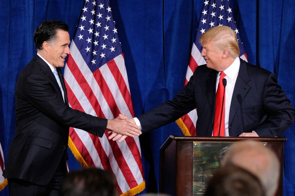 Mitt Romney (l.) shaking hands with Donald Trump during a news conference where Trump endorsed Romney for president in Las Vegas, Nevada on February 2, 2012.