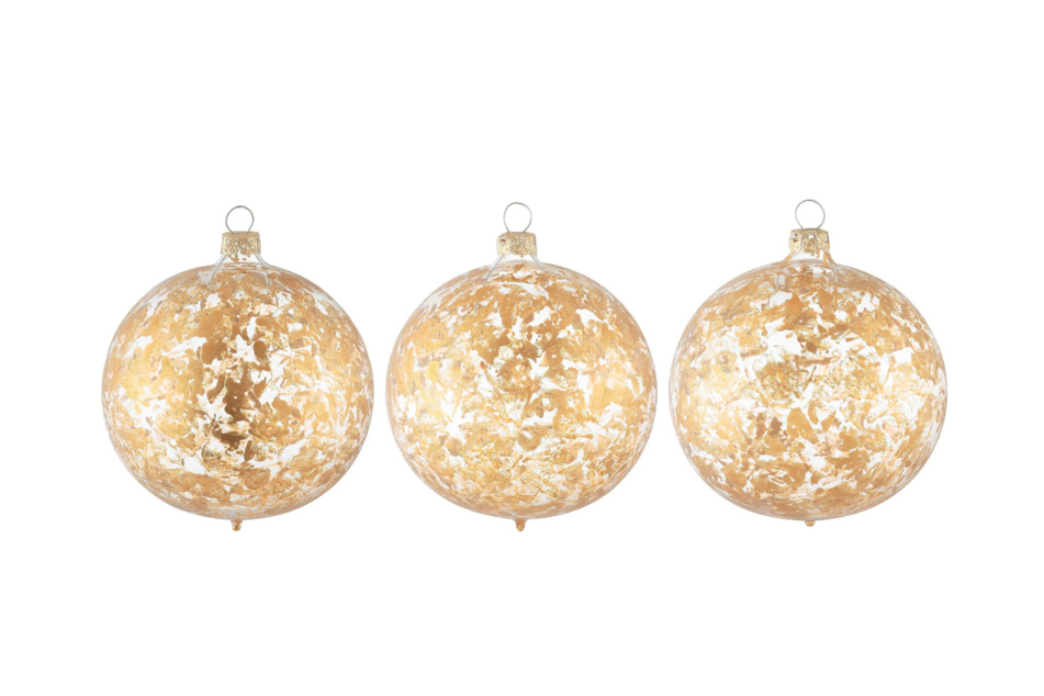 Die Weihnachtskugeln "Sannah" von Guido Maria Kretschmer sind mit einem Muster aus goldenen Partikeln verziert.