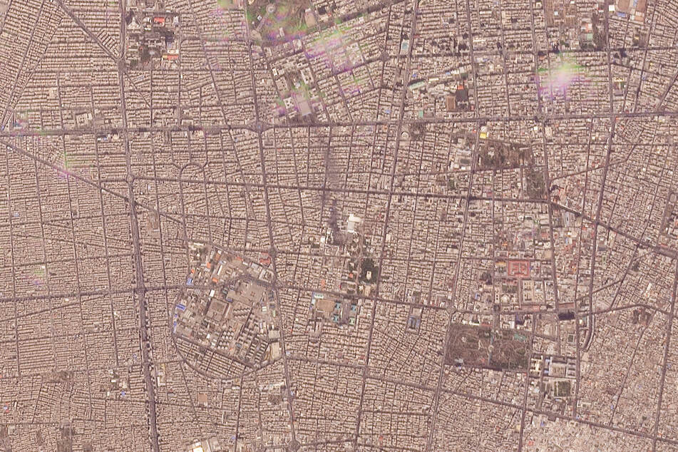 A satellite image shows what appears to be a plume of light black smoke reportedly ascending from the compound of Iran's supreme leader, Ayatollah Ali Khamenei.