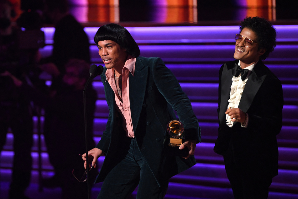 R&amp;B duo Silk Sonic accept the award for Record Of The Year for Leave The Door Open during the 64th Annual Grammy Awards on April 3.