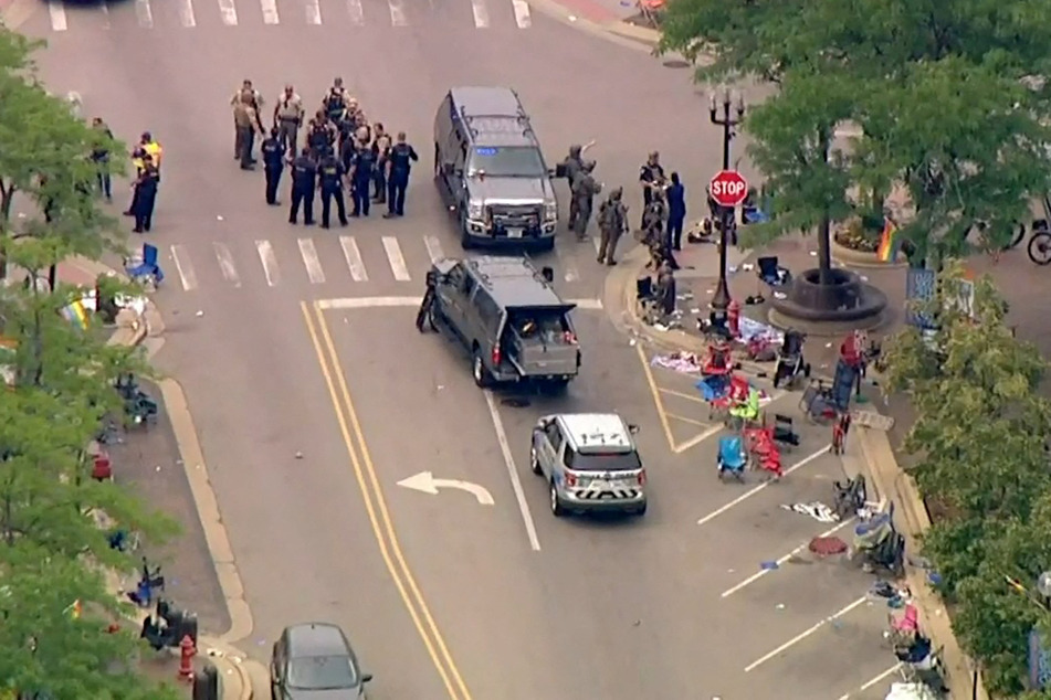 A heavy police presence on the parade route in Highland Park Illinois, where a mass shooting killed or injured dozens of people.