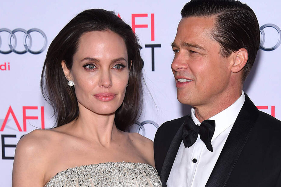 Ein Bild aus glücklichen Tagen: Angelina Jolie und Brad Pitt stecken eigentlich mitten in der Scheidung, nun will sie ihren Ex angeblich zurück.