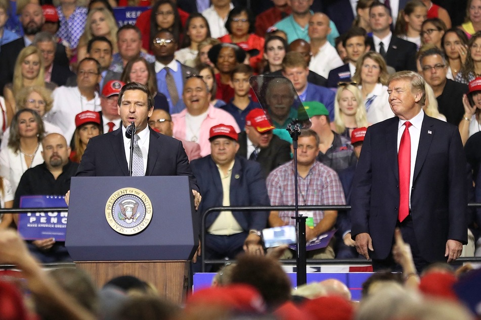 Though Ron DeSantis (l) may not agree with Donald Trump's language, the two candidates have touted similar anti-immigration rhetoric.