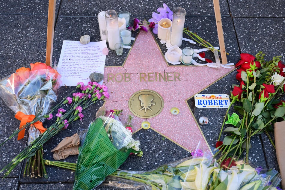 Flowers, candles, and a letter are seen on the Hollywood Walk of Fame star of the late actor and director Rob Reiner on December 16, 2025.
