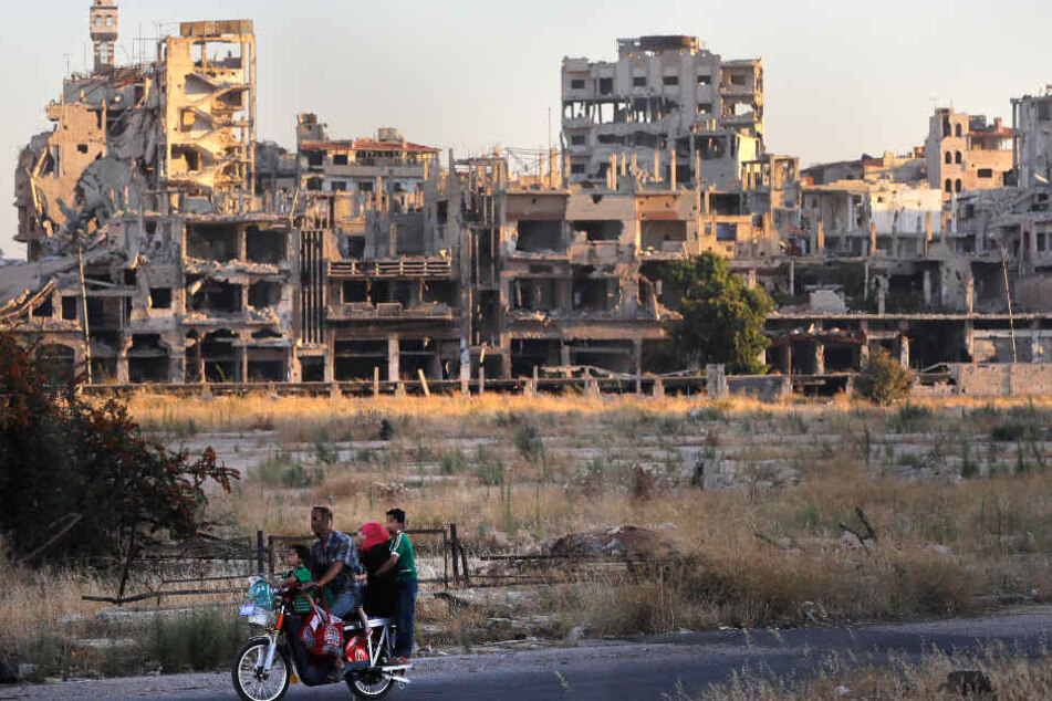 Das Foto zeigt durch den Bürgerkrieg zerstörte Häuser in Syrien.