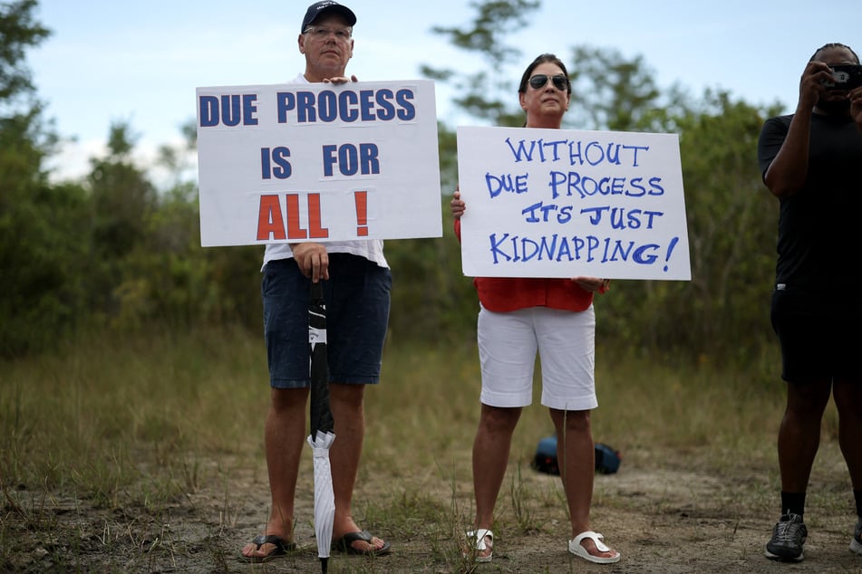 Faith leaders lead prayers near the entrance to Alligator Alcatraz on August 3, 2025, in Ochopee, Florida.