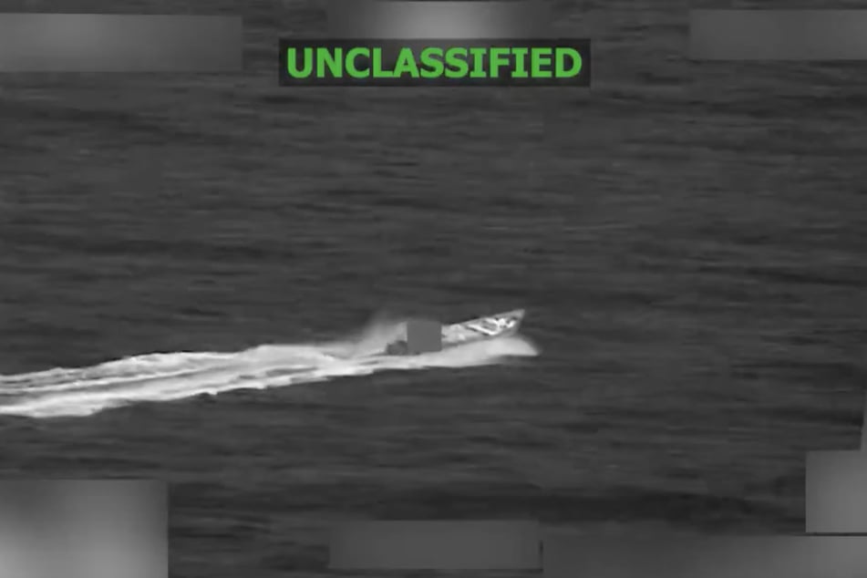 A screenshot from a video shared to X by US Southern Command shows a boat in the eastern Pacific shortly before it is struck by American forces.