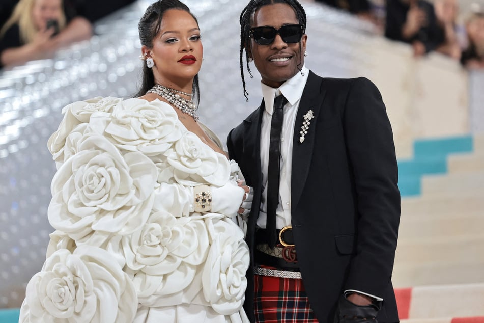 Rihanna and A$AP Rocky (r.) have found a way to keep the rapper's lawyer in the family after their big court win!