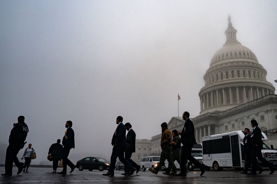 Fog hovers over the dome of the US Capitol on Tuesday in Washington, DC.