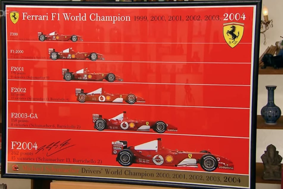 Das Ferrari-Poster hatte eine Signatur von Rennfahrer Michael Schumacher (53).