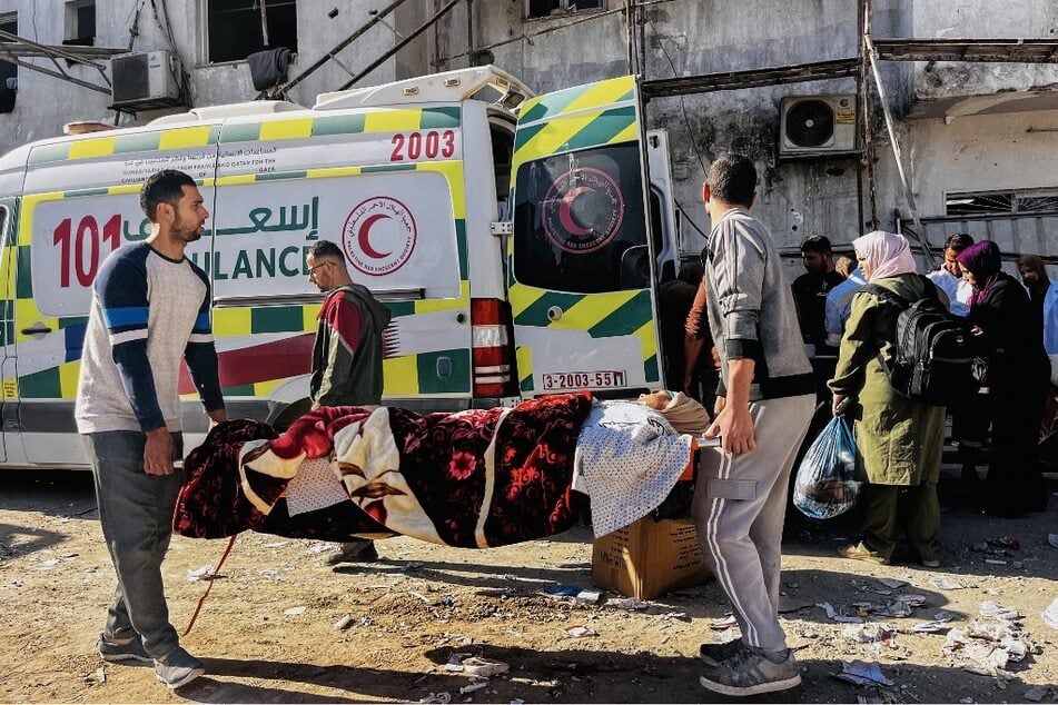 Medics evacuate injured people and cancer patients from the Kamal Adwan Hospital in Beit Lahia in the northern Gaza Strip.