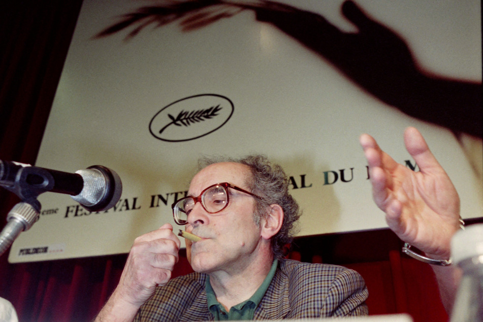 Film director Jean-Luc Godard smoking a cigar at the Cannes International Film Festival in Cannes in 1990.