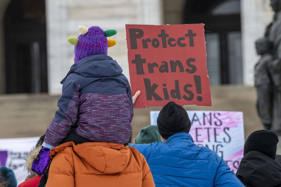 Minnesotans hold a rally in support of trans youth outside the state Capitol in St. Paul.