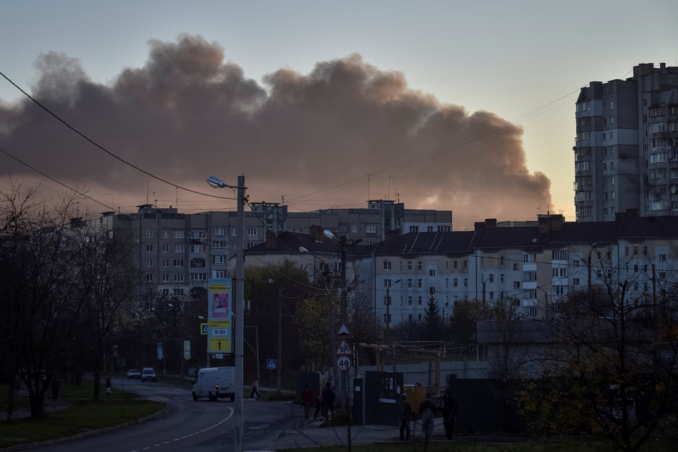 Smoke billows over Lviv after Tuesday's large-scale Russian bombing of Ukraine.