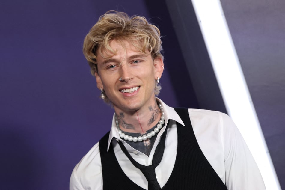 Rapper and singer Machine Gun Kelly arrives for the 51st American Music Awards at the Fontainebleau in Las Vegas, Nevada on Monday.
