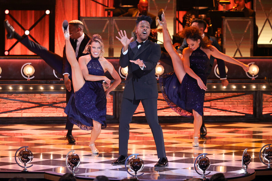 Leslie Odom, Jr. (c.) and ensemble members performed an original opening number, Broadway's Back, during the 74th Annual Tony Awards at Winter Garden Theatre on Sunday night.