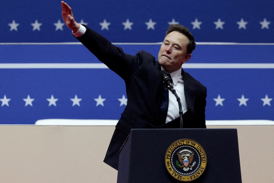 Elon Musk gestures at the podium inside the Capital One arena on the inauguration day of President Donald Trump's second term.