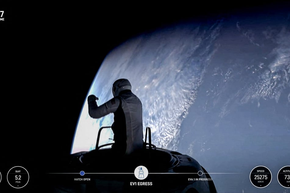 This still image taken from a SpaceX and Polaris broadcast on Thursday shows US fintech billionaire Jared Isaacman (EV1) peeking out to space from a hatch structure called Skywalker during the first private spacewalk performed by the crew of the SpaceX Polaris Dawn mission.