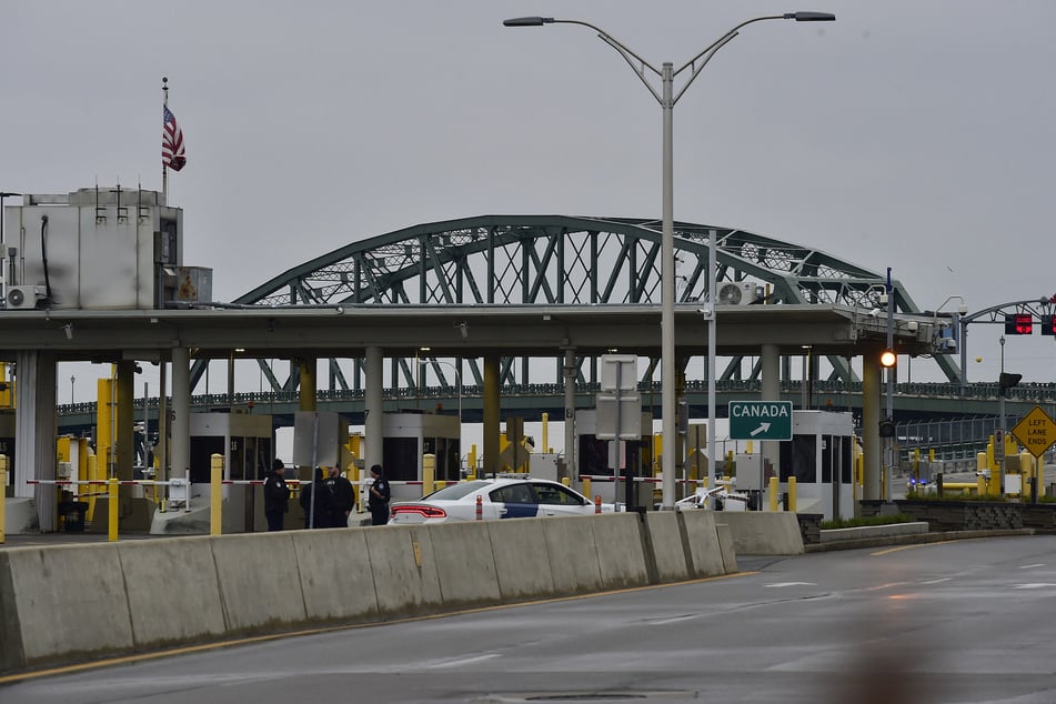 US terrorism investigators were deployed Wednesday after a car erupted into a fireball at a US-Canada checkpoint, triggering border closures on one of the busiest travel days of the year.